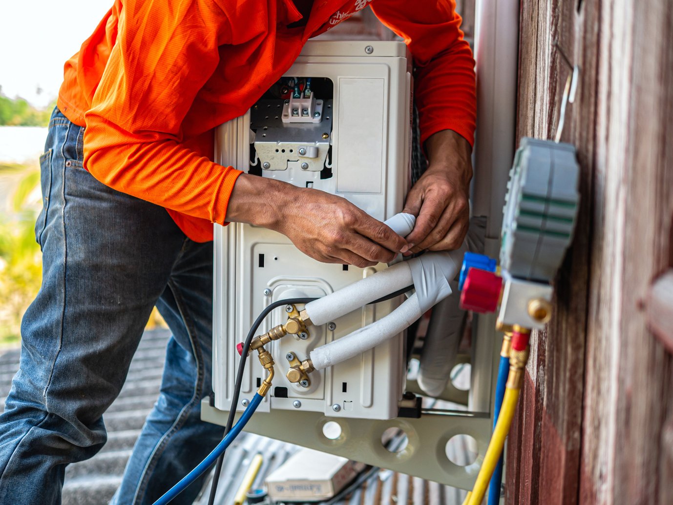 Air conditioning technicians install new compressor air in homes